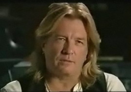 Bob Rock, with long strawberry-blond hair