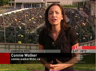 Connie Walker (Chyroned as such) standing outside temporary garbage dump