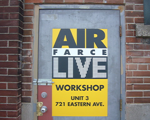 Sign on door reads AIR FARCE LIVE WORKSHOP UNIT 3 721 EASTERN AVE.