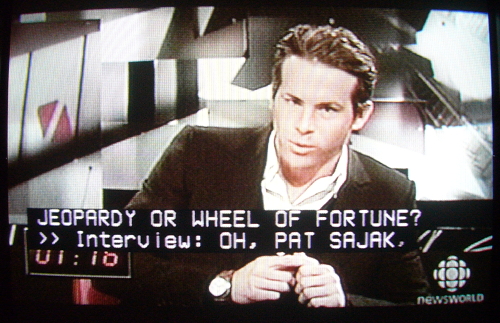 Ryan Reynolds on Newsworld program. Caption: JEOPARDY OR WHEEL OF FORTUNE? >> Interview: OH, PAT SAJAK