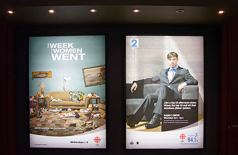Two billboards in illuminated caissons: One for ‘The Week the Women Went,’ another showing Rich Terfry for Radio 2