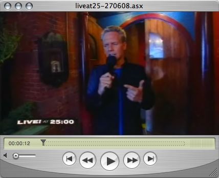 QuickTime window showing Jonathan Torrens hosting a show