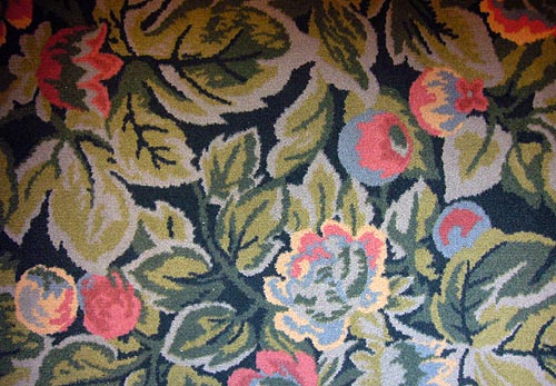 Green-toned, floral-patterned carpet