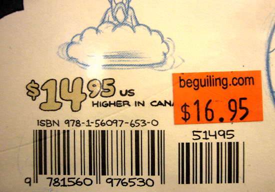 Handwritten price and other labels alongside an orange tag from Beguiling: $16.95