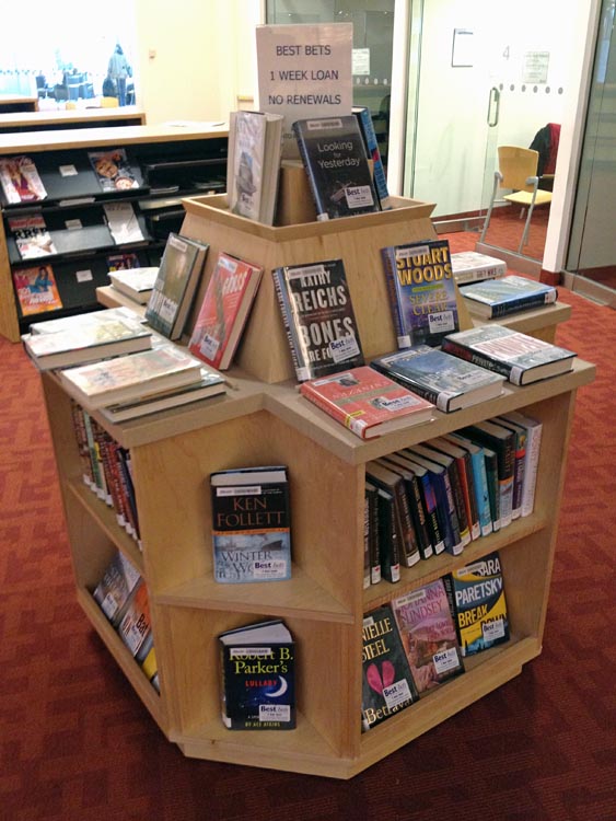 Best Bets piled on top of each other on wooden stand
