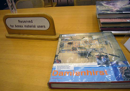 ‘Damienhirst’ book on desk with sign reading Reserved for Annex material users