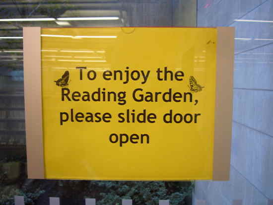 Sign on window: To enjoy the Reading Garden, please slide door open