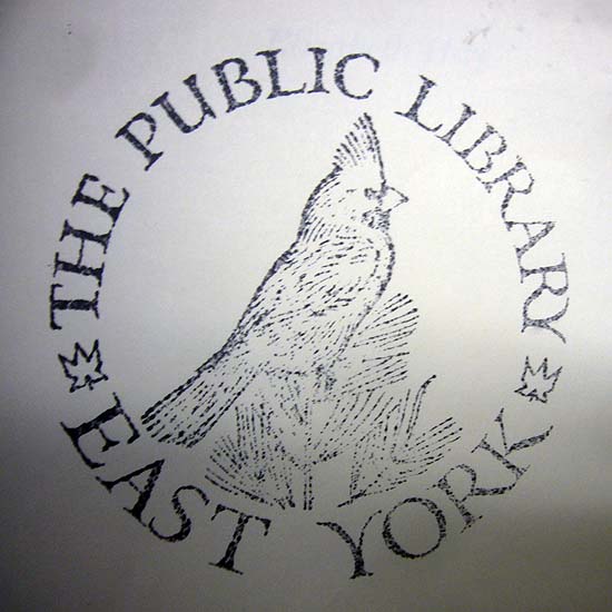 Woodcut of a cardinal encircled by the words THE PUBLIC LIBRARY EAST YORK