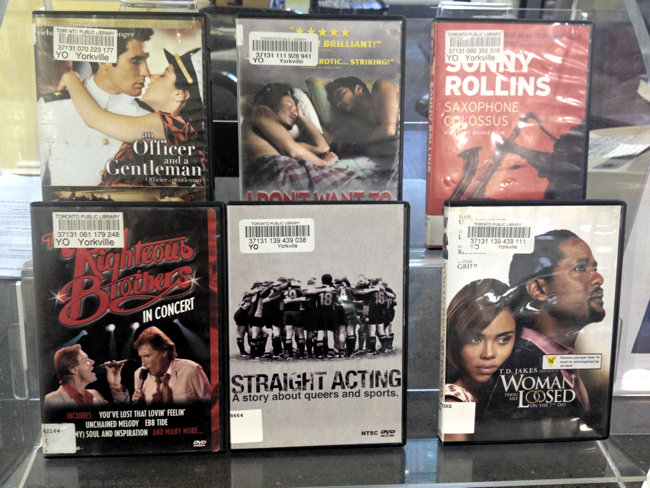 ‘Straight Acting’ is one of six DVDs on a two-tiered display case