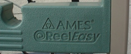 Green plastic implement shows a triangular logo, ‘AMES’ in Friz Quadrata, and ‘ReelEasy’ in Avant Garde Gothic Bold and Bold Oblique