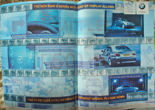 Two-page advertising spread showing product shots and simulated film frames on a blurred blue-tinged background