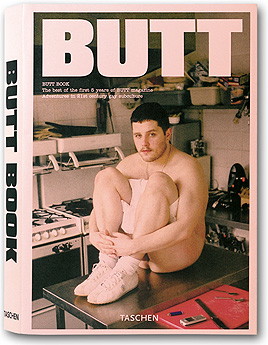 ‘Butt Book’ cover (pink stock, B&W photo of nude man in sneakers seated on metal counter with his arms around his knees)