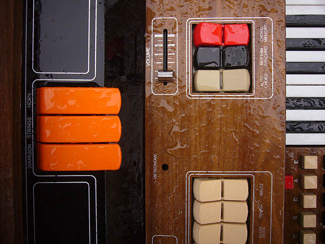 Orange and white keys of a rainy old organ