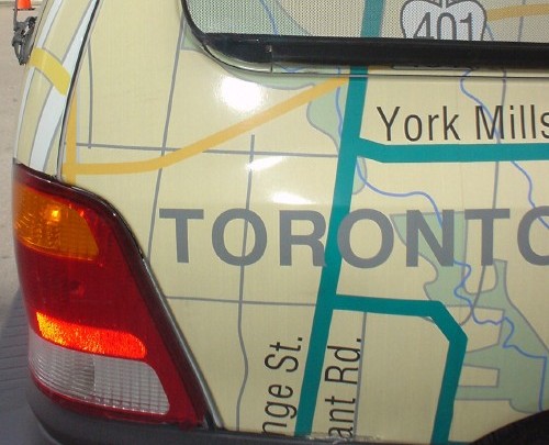 Minivan with vinyl appliqué showing map of Toronto