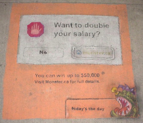 Chalk drawing on sidewalk has peach background and shows a dialogue box reading ‘Want to double your salary?’ with two buttons, No and Monster.ca