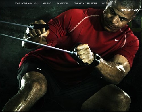 Screenshot shows Nike-shirted, sweat-caked Jarome Iginla leaning back and straining against cable pulls