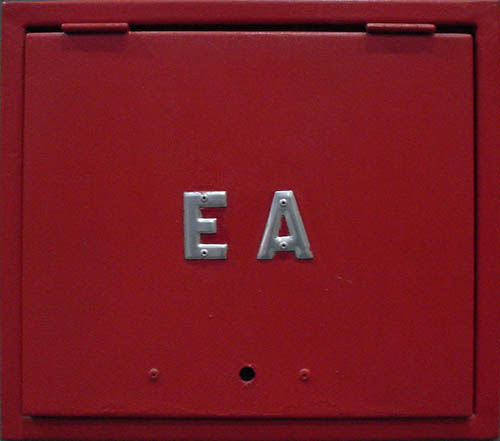 Red utility door with silver letters ‘EA’