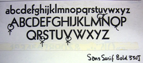 Marked-up type specimen is hand-labelled Sans Serif Bold 330J