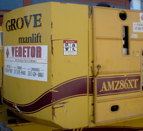Yellow crane body is labeled GROVE manlift VENETOR AMZ86XT