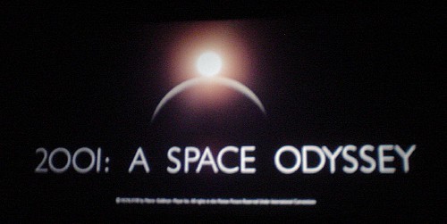 Title card shows a star eclipsing a penumbra and the words  ‘2001: A Space Odyssey’