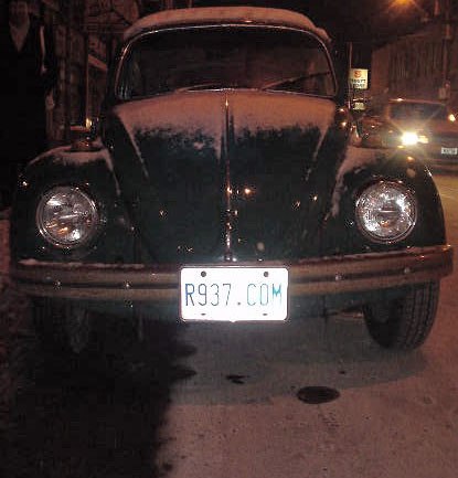 Rudy Limeback’s Beetle (license place R937“.”COM), College St., midwinter