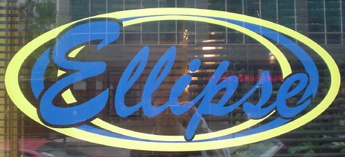 Yellow and blue ellipses surround the word ‘Ellipse’ written in blue script