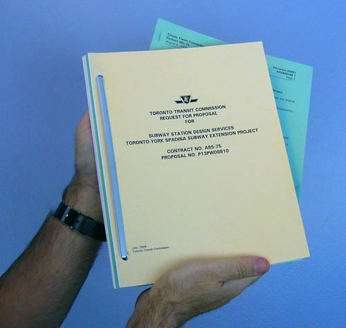 Me holding two bound documents