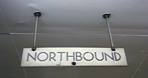 White overhead sign reads NORTHBOUND in black light-weight TTC font