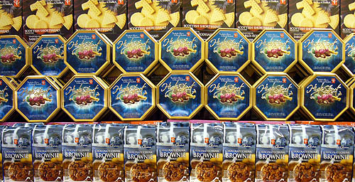 A wall of different rows of identical colourful cookie packages