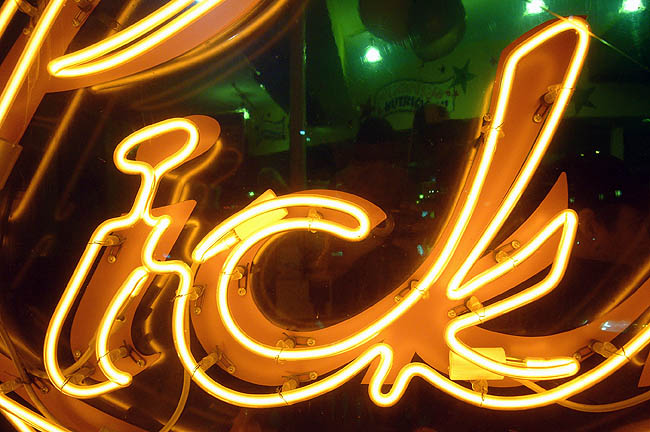 Script on neon sign reads ick
