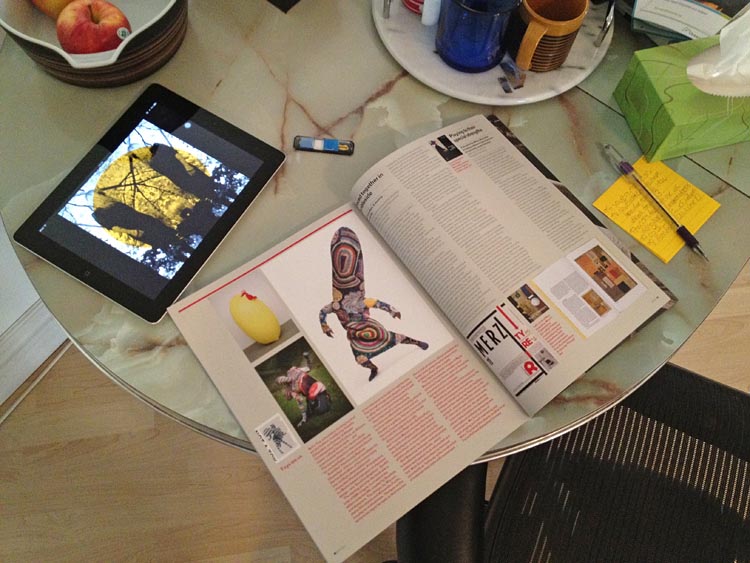 ‘Eye’ magazine, iPad, notes on marble-topped table