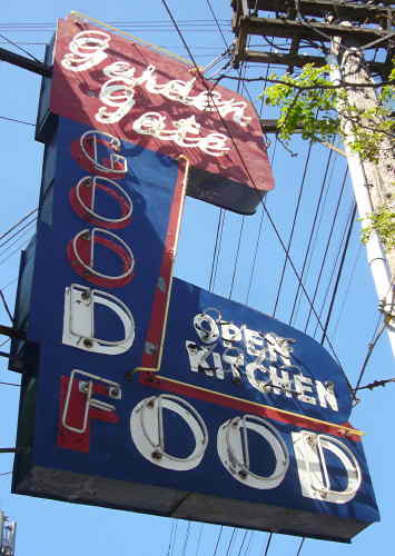 Elaborate L-shaped neon sign: Garden Gate GOOD FOOD OPEN KITCHEN