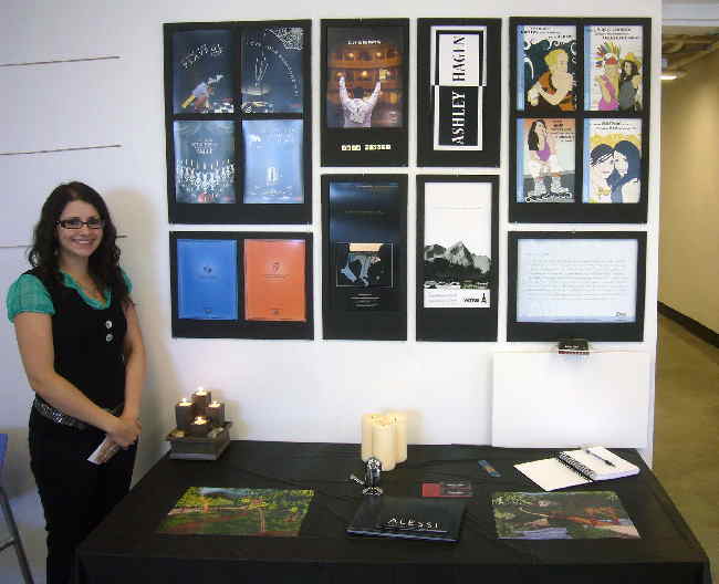 Ashley in front of her display wall