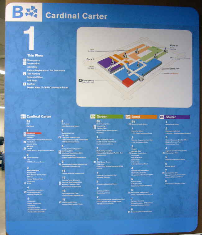 Large blue sign with white type and a map