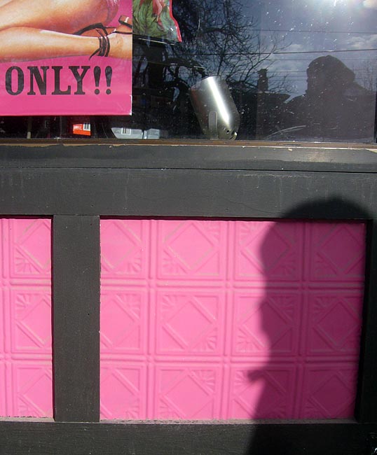 Pink panels under store window, which shows a pink banner with a woman’s leg and ONLY!!