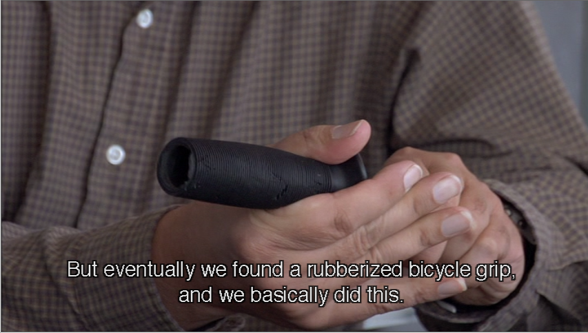 Man holds bicycle grip on utensil: But eventually we founod a rubberized bicycle grip, and we basically did this