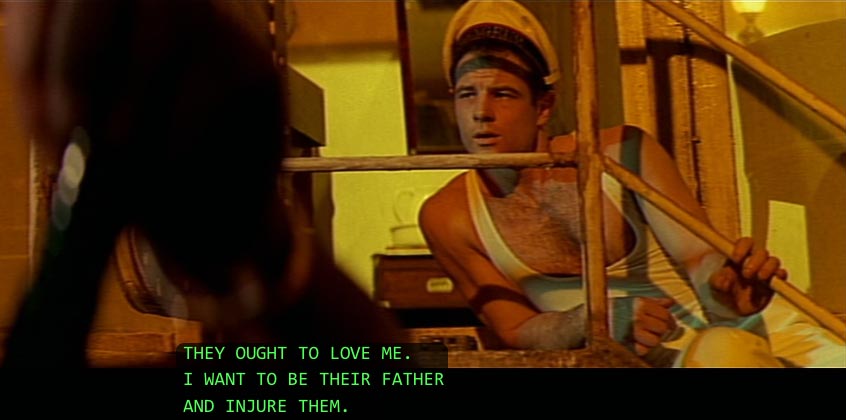 Brad Davis, in low-slung tank top, leaning across stairway landing: They ought to love me. I want to be their father and injure them