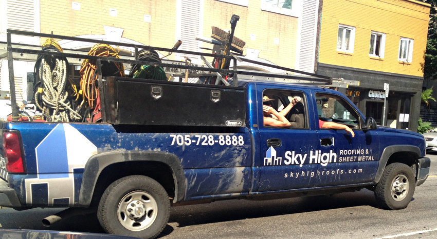 Sky High Roofing & Sheet Metal king-cab truck with guys leaning arms out the side windows