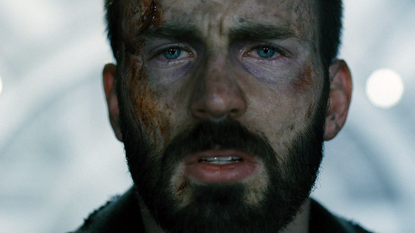 Chris Evans looking straight at us: Blue eyes, dirt face, deep black beard