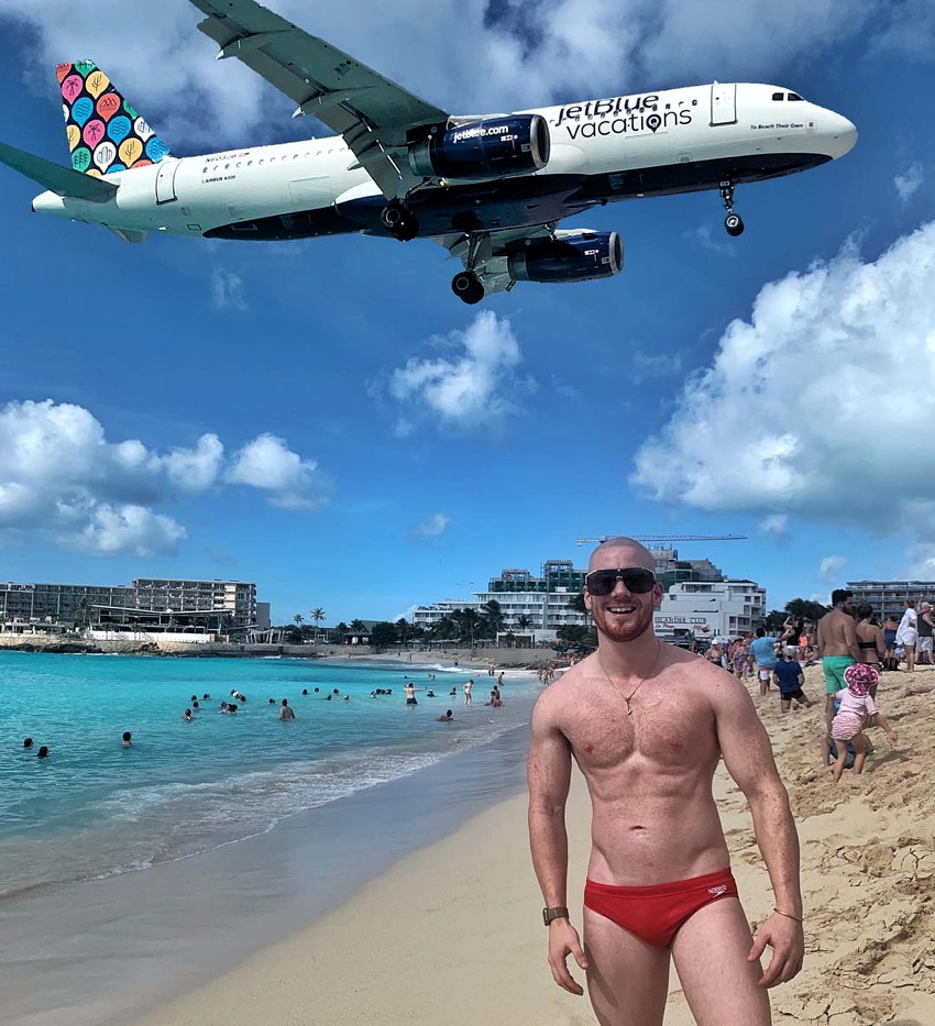 Ginger in Speedo on beach as JetBlue plane flies shockingly close overhead