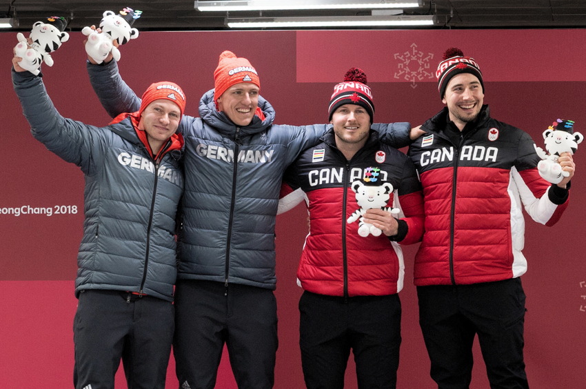  Thorsten Margis, Francesco Friedrich, Justin Kripps, and Alex Kopacz on medal podium