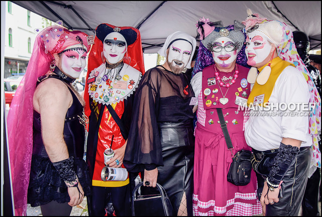 Five transvestites in white face paint and headgear